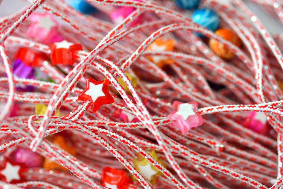 Close-up of intricate hair charm collection on soft fabric